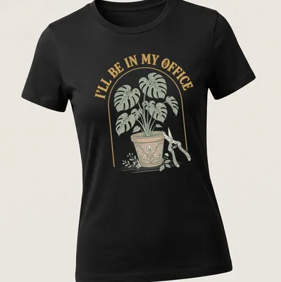 Vintage botanical shirt featuring a houseplant and text about being in the office — printed on a women's shirt