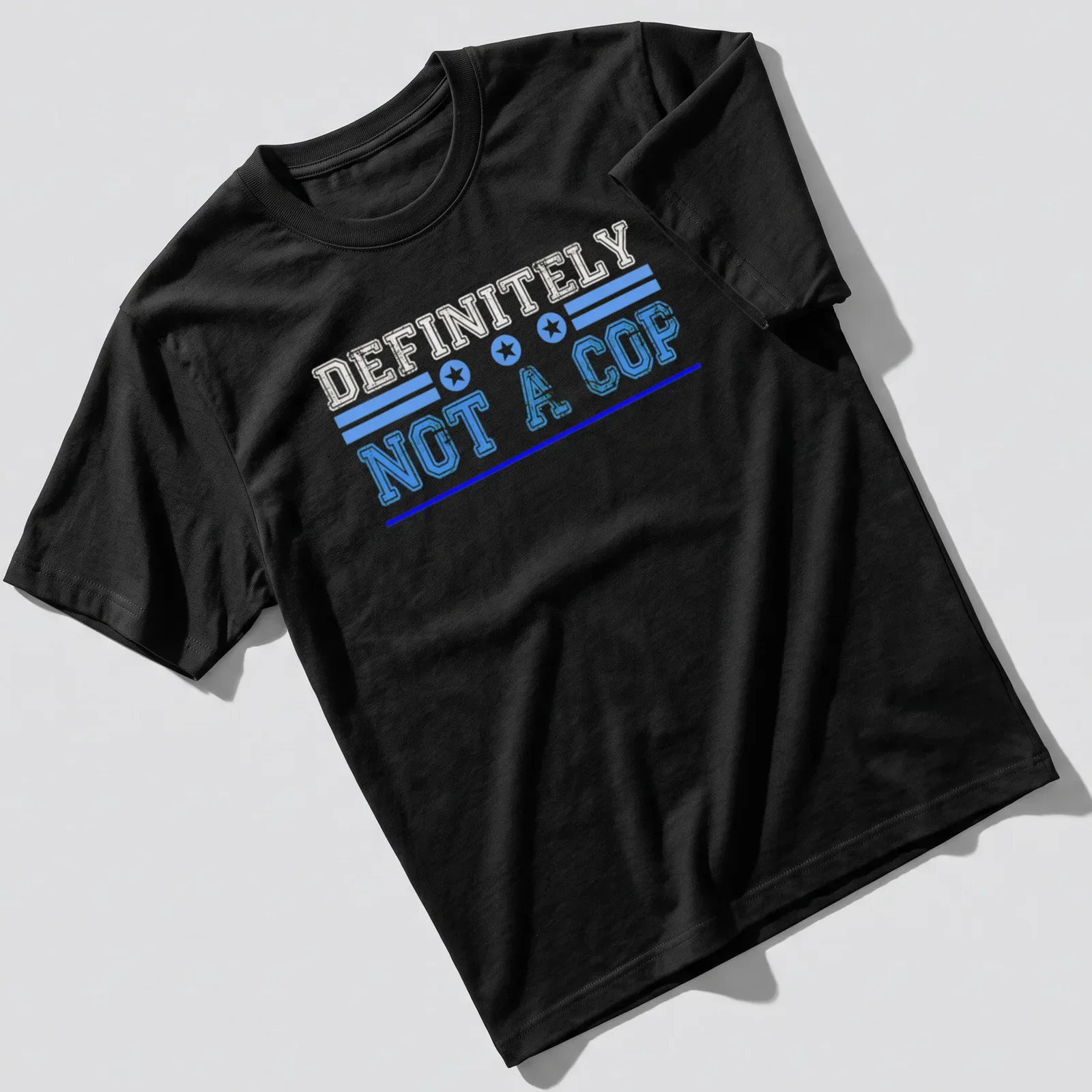 Bold vintage print reading 'DEFINITELY NOT A COP' in blue and white. — printed on a unisex t-shirt