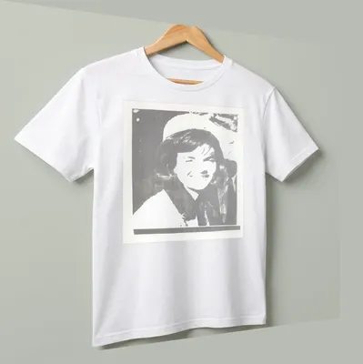 Pop art illustration of Jacqueline Kennedy in black, white, and gray — printed on a unisex t-shirt (angled view)