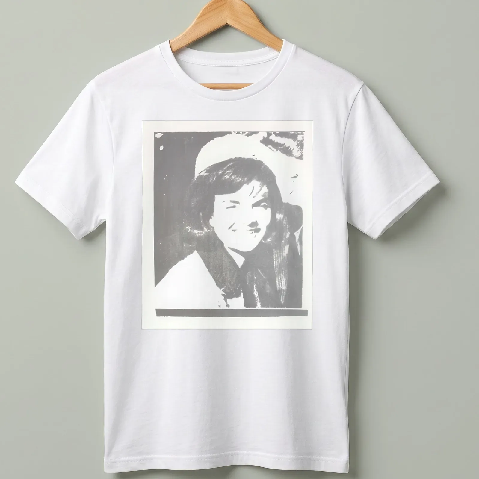Pop art illustration of Jacqueline Kennedy in black, white, and gray — printed on a unisex t-shirt