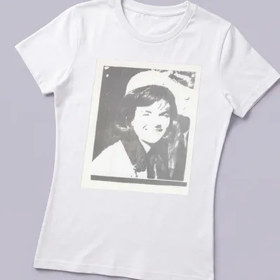 Pop art illustration of Jacqueline Kennedy in black, white, and gray — printed on a women's shirt
