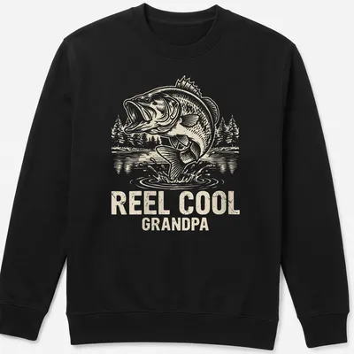 Vintage line-art design featuring a jumping bass with text 'REEL COOL GRANDPA' — printed on a unisex sweatshirt