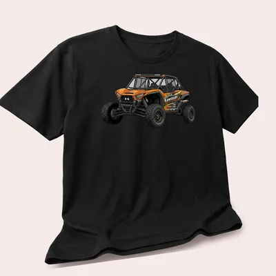 Realistic Kawasaki Teryx graphic with bold text on an orange background — printed on a unisex t-shirt (angled view)