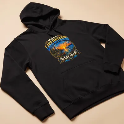Vibrant landscape of Lake Ontario at sunset with a lighthouse and sailboat. — printed on a unisex hoodie