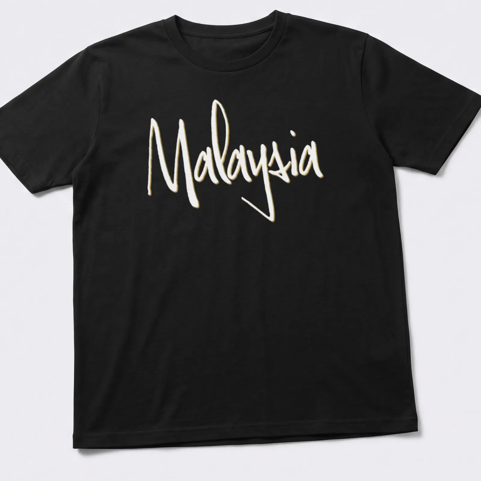 Elegant typography design featuring the word Malaysia in gold and white. — printed on a unisex t-shirt