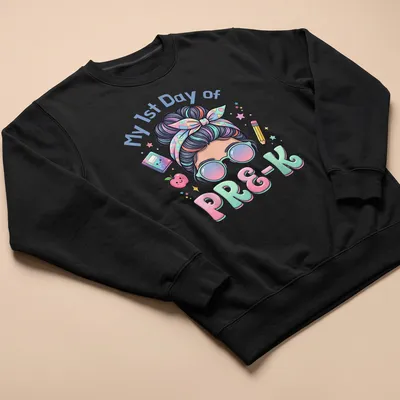 Kawaii cartoon girl with messy bun on a pastel background, celebrating first day of preschool — printed on a unisex sweatshirt