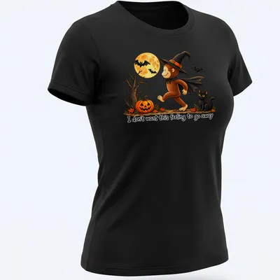 Whimsical illustration of a monkey in a witch hat with playful text — printed on a women's shirt