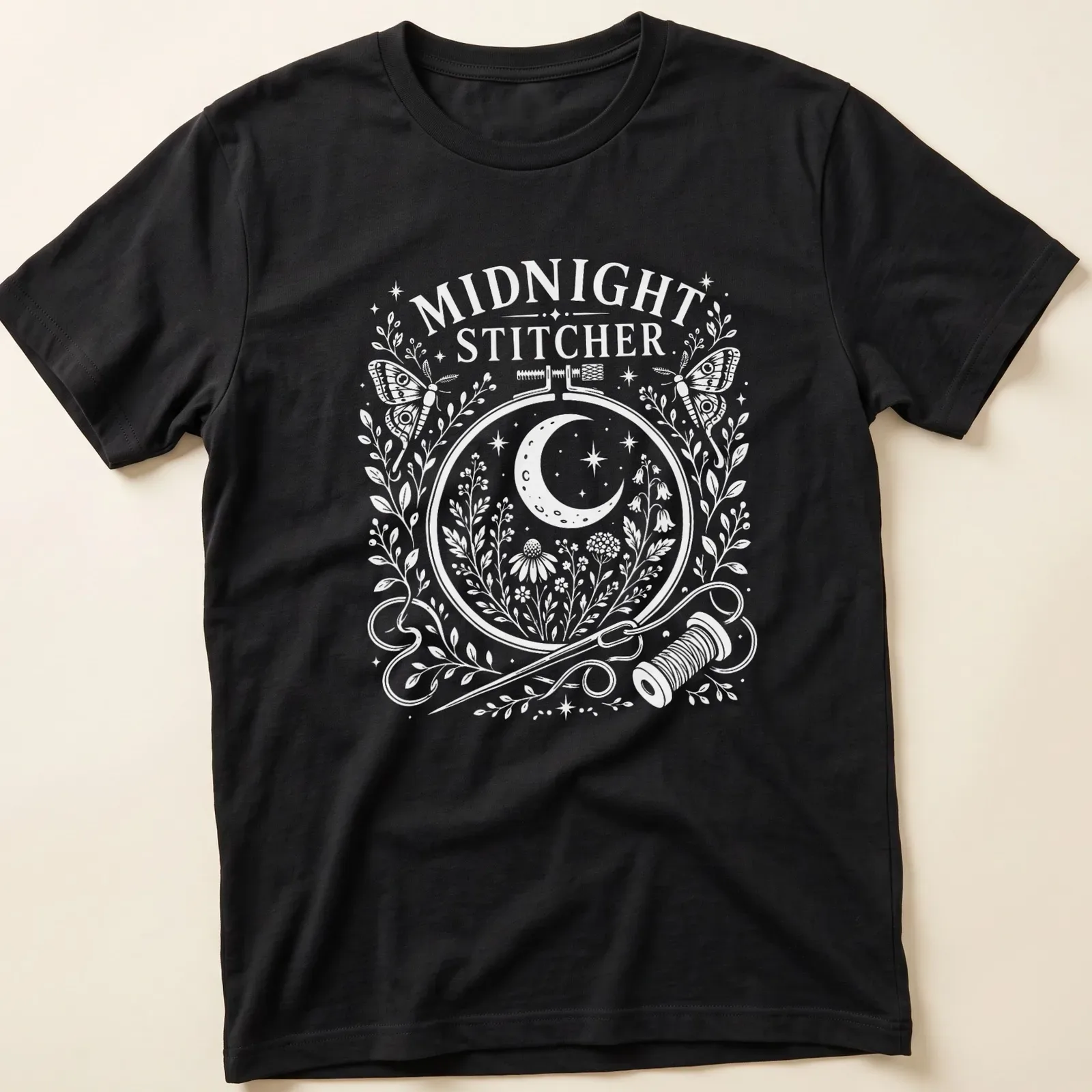 Folk art moon moth with text 'Midnight Stitcher' in pastel colors — printed on a unisex t-shirt