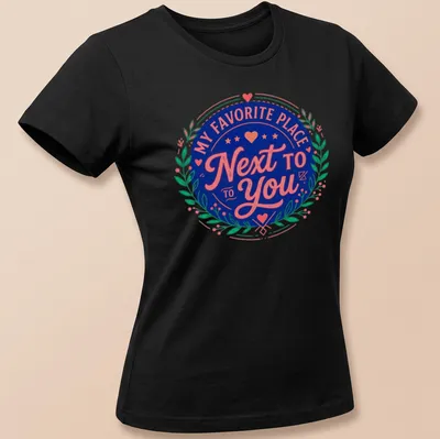 Vintage badge design tee with romantic text in navy, pink, and green. — printed on a women's shirt