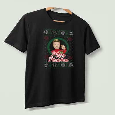 Festive cartoon t-shirt with Merry Nickmas text and Nick Carter illustration — printed on a unisex t-shirt (angled view)