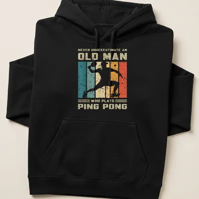 Vintage distressed tee featuring an old man playing ping pong with humorous text — printed on a unisex hoodie