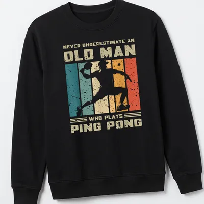 Vintage distressed tee featuring an old man playing ping pong with humorous text — printed on a unisex sweatshirt