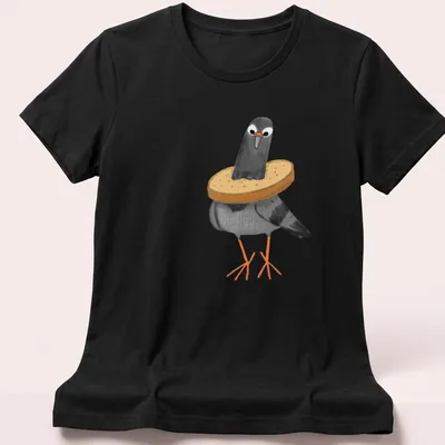 Cartoon design of a pigeon humorously stuck in slices of bread — printed on a women's shirt