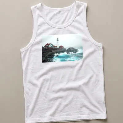 Photographic print of a lighthouse enduring ocean storm waves in blue and gray — printed on a tank top
