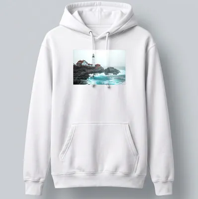 Photographic print of a lighthouse enduring ocean storm waves in blue and gray — printed on a unisex hoodie