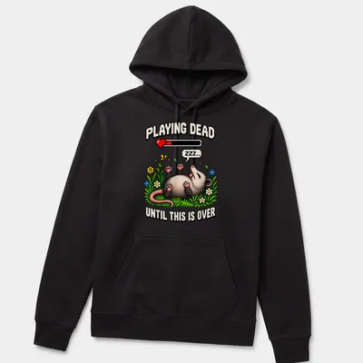 Pixel art of a possum with text saying 'Playing Dead Until This Is Over' in various colors — printed on a unisex hoodie