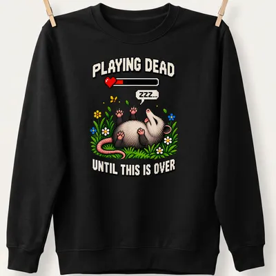 Pixel art of a possum with text saying 'Playing Dead Until This Is Over' in various colors — printed on a unisex sweatshirt