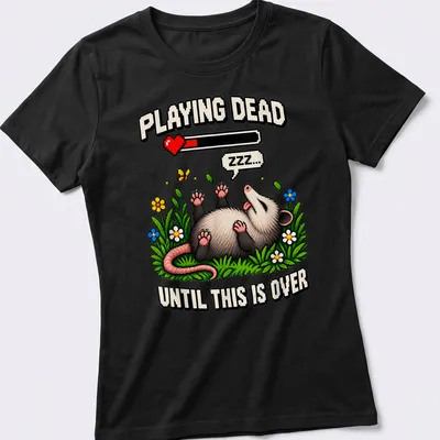 Pixel art of a possum with text saying 'Playing Dead Until This Is Over' in various colors — printed on a women's shirt
