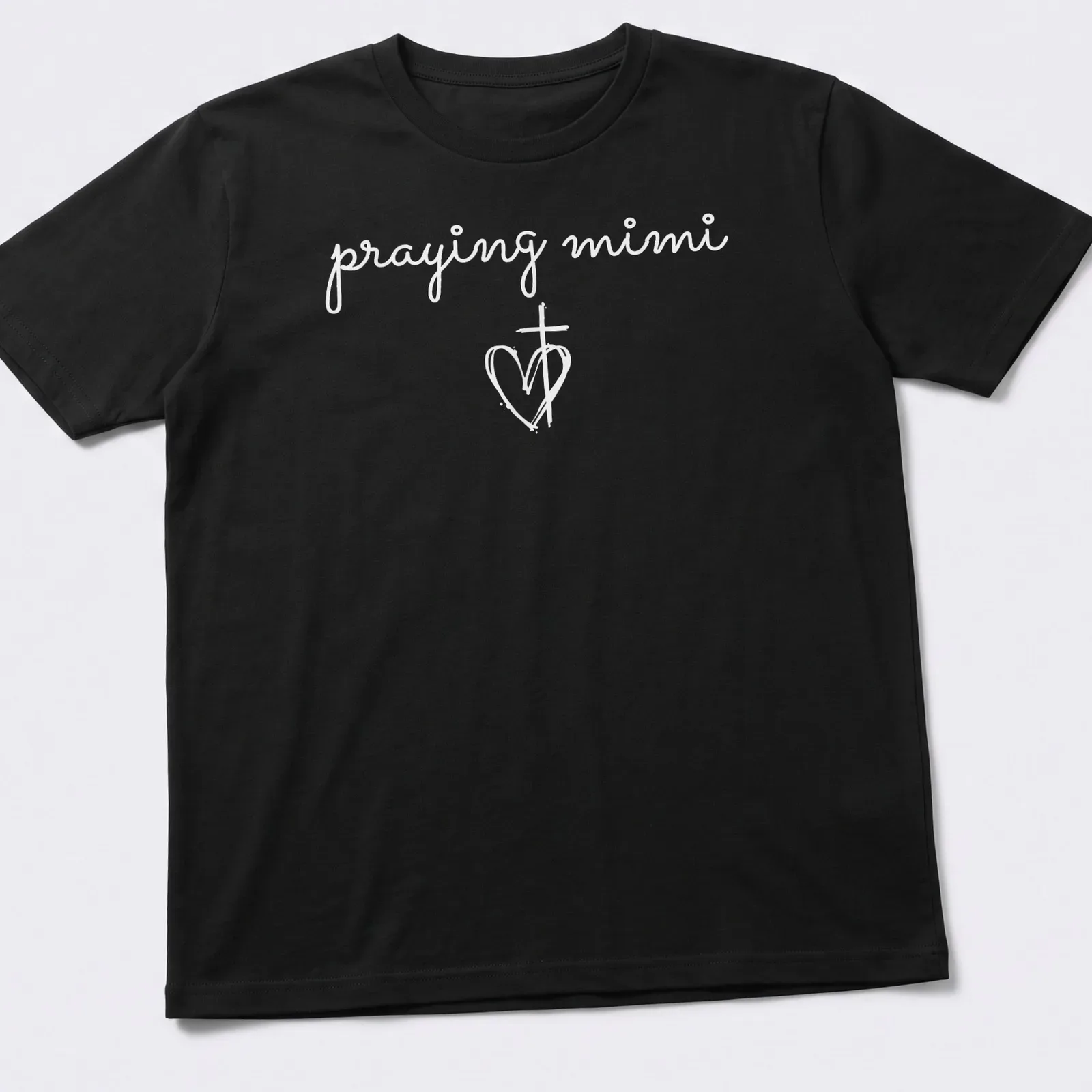 Simple white T-shirt featuring a heart and cross with 'praying mimi' text — printed on a unisex t-shirt