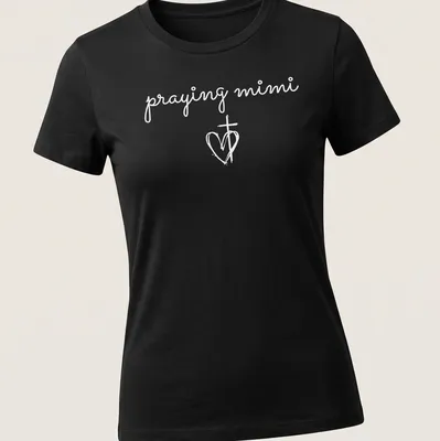 Simple white T-shirt featuring a heart and cross with 'praying mimi' text — printed on a women's shirt