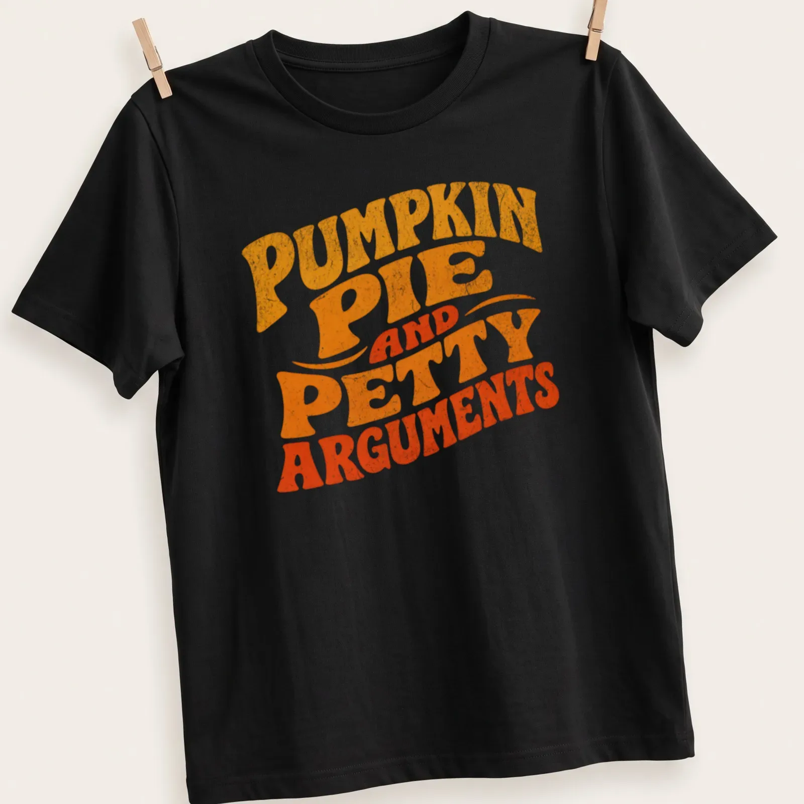 Retro distressed shirt featuring pumpkin pie and humorous text about petty arguments — printed on a unisex t-shirt