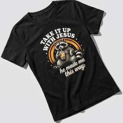Vintage retro print of a raccoon holding a soda with humorous text — printed on a women's shirt