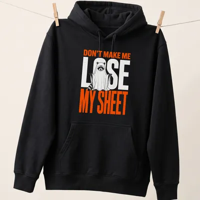 Funny cartoon print of a raccoon ghost with text Don't Make Me Lose My Sheet — printed on a unisex hoodie