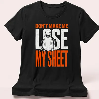 Funny cartoon print of a raccoon ghost with text Don't Make Me Lose My Sheet — printed on a women's shirt
