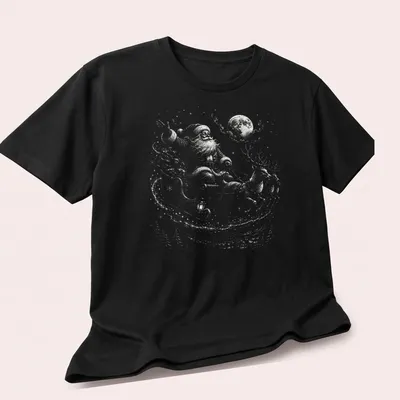 Vintage Santa Claus with reindeer under a moonlit sky, in shades of gray and blue — printed on a unisex t-shirt (angled view)