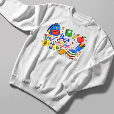 Colorful hand-drawn shirt with school supplies and text about learning — printed on a unisex sweatshirt