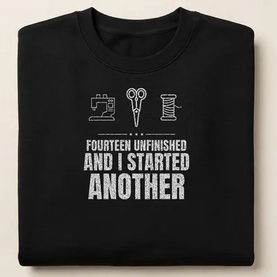 Typography t-shirt featuring a sewing machine, scissors, and a spool with humorous text — printed on a unisex sweatshirt