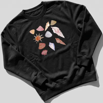 Watercolor pattern featuring various shells in soft hues of pink, peach, beige, purple, and orange. — printed on a unisex sweatshirt