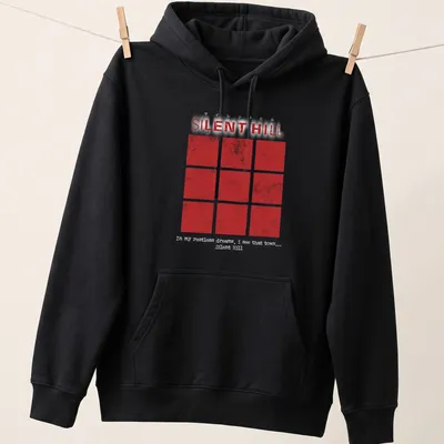 Grunge-style t-shirt featuring red squares and Silent Hill text. — printed on a unisex hoodie