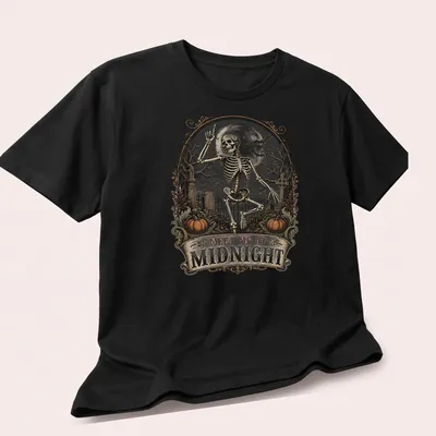 Vintage gothic t-shirt with skeleton and text 'MEET ME AT MIDNIGHT' in black, white, orange, and gray — printed on a unisex t-shirt (angled view)