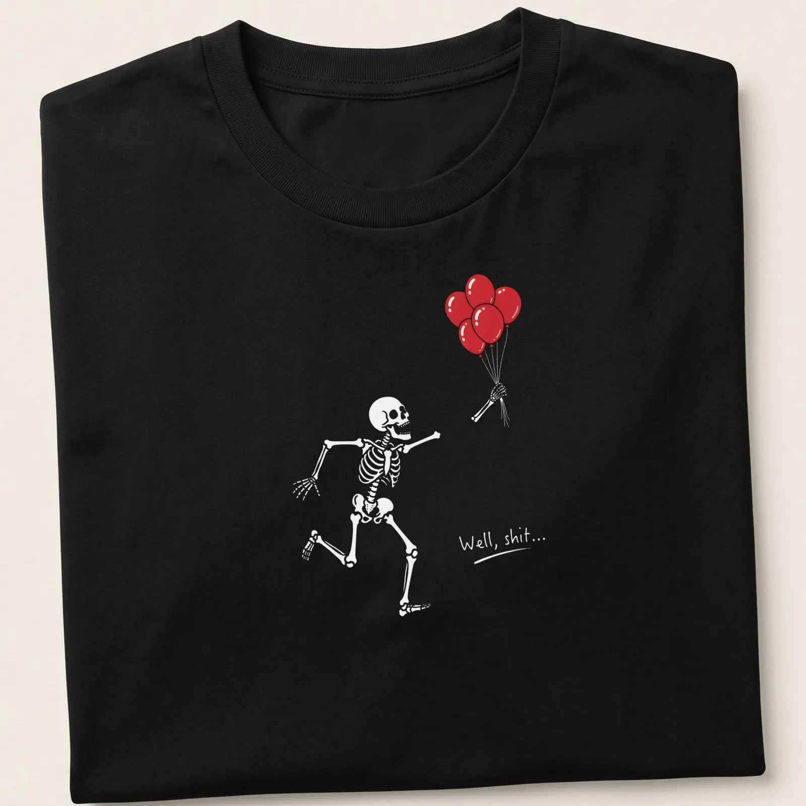 Funny cartoon skeleton holding red balloons with the text 'Well shit...' — printed on a unisex t-shirt