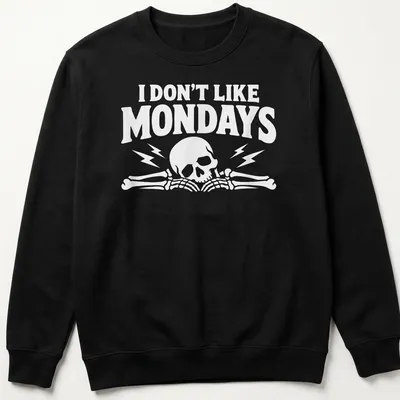 Bold graphic of a skull and bones with text 'I DON'T LIKE MONDAYS' — printed on a unisex sweatshirt