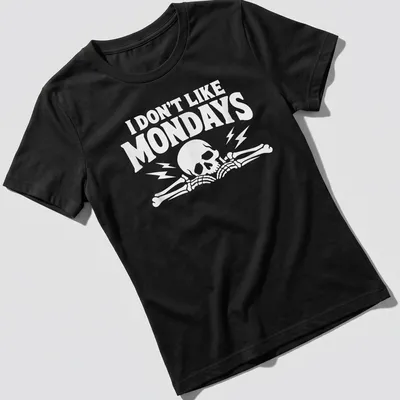 Bold graphic of a skull and bones with text 'I DON'T LIKE MONDAYS' — printed on a women's shirt