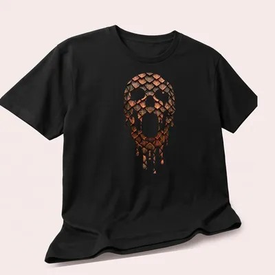 Illustration of a skull with metallic scale armor dripping in copper and dark tones — printed on a unisex t-shirt (angled view)