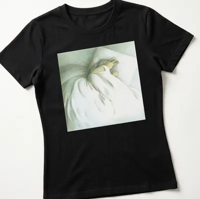 Illustration of a sleeping bunny with the text 'Go Back To Sleep' in soft colors. — printed on a women's shirt