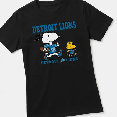 Snoopy and Woodstock cartoon on a Detroit Lions football fan — printed on a women's shirt