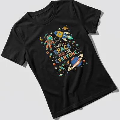 Colorful astronaut and rocket graphic with inclusive quote about space — printed on a women's shirt