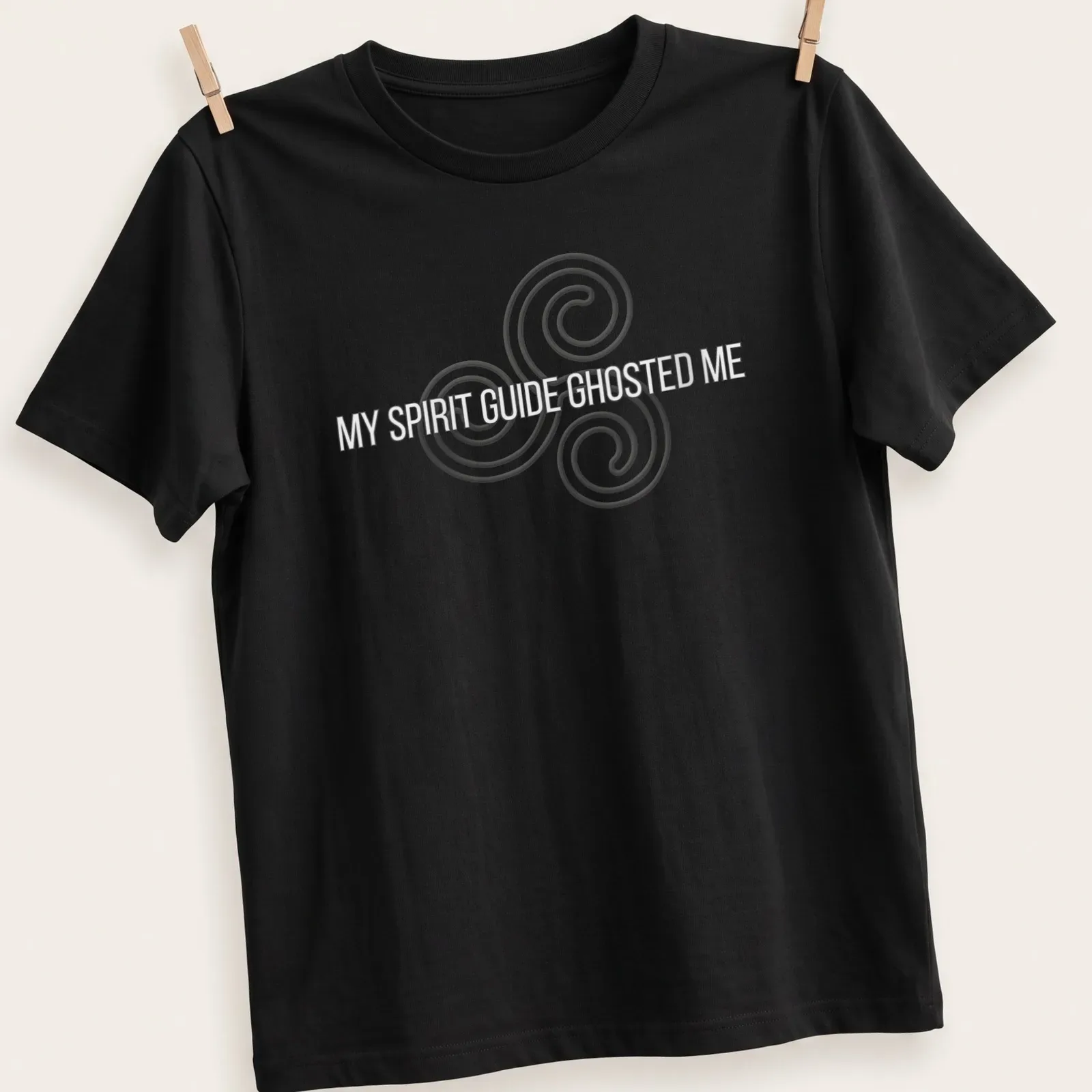 Minimalist t-shirt with the text 'MY SPIRIT GUIDE GHOSTED ME' and a spiral design — printed on a unisex t-shirt