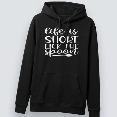 Playful design of a spoon with text 'Life Is Short Lick The Spoon' in black and white. — printed on a unisex hoodie