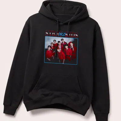 Vintage-inspired Stray Kids t-shirt featuring bold text and a playful design in red, white, and blue. — printed on a unisex hoodie