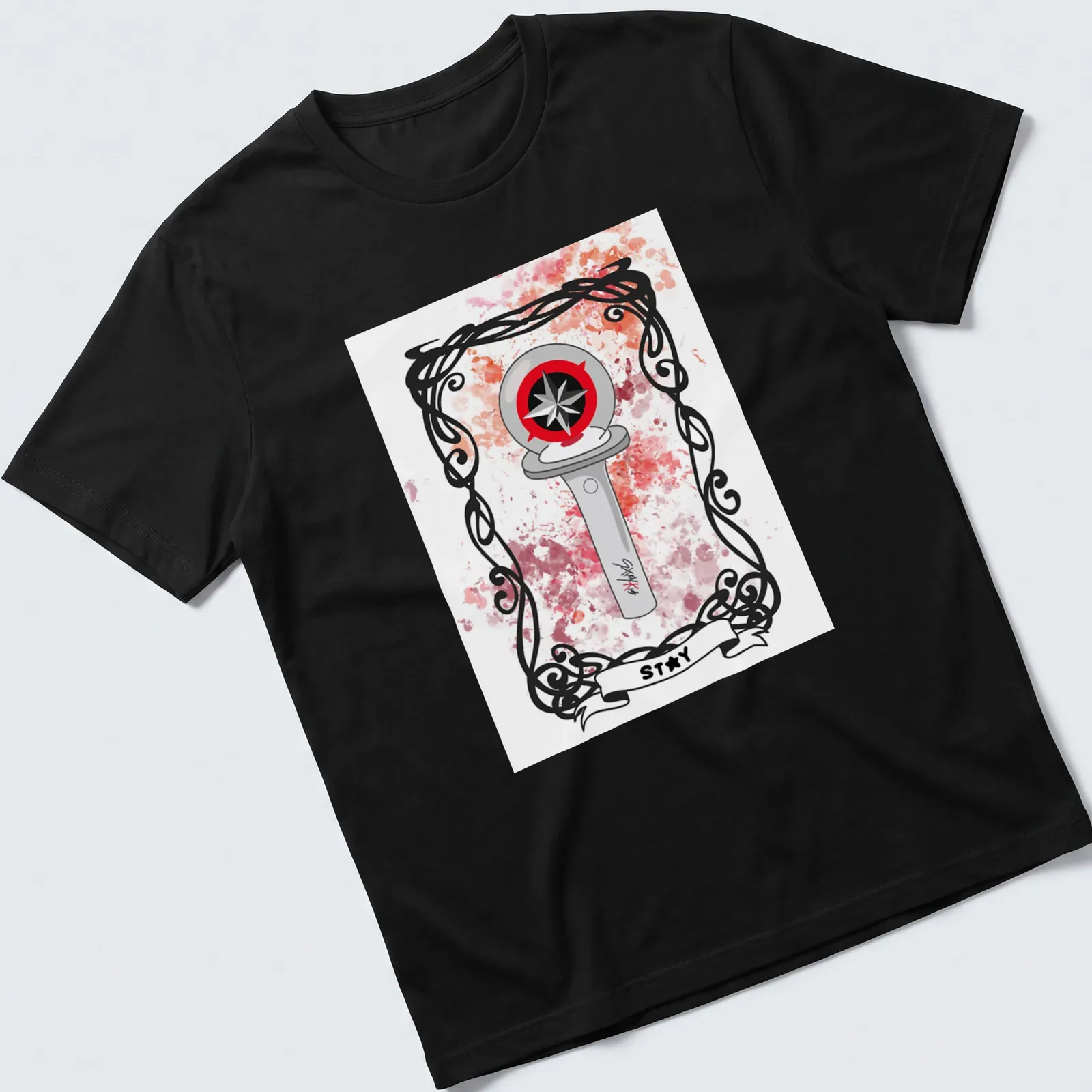 Illustrative compass design with the word Stay on a watercolor background in various colors — printed on a unisex t-shirt