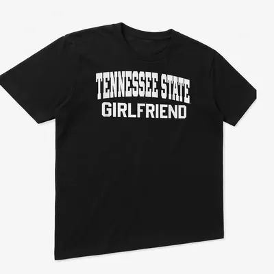 Bold collegiate print of Tennessee State Girlfriend text in white — printed on a unisex t-shirt (angled view)