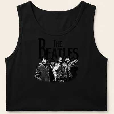 Vintage distressed t-shirt featuring bold text of 'THE BEATLES' in black and white — printed on a tank top