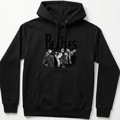 Vintage distressed t-shirt featuring bold text of 'THE BEATLES' in black and white — printed on a unisex hoodie