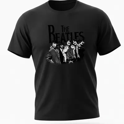 Vintage distressed t-shirt featuring bold text of 'THE BEATLES' in black and white