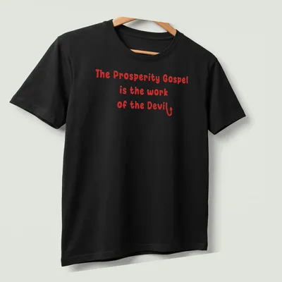 Bold typography design stating 'The Prosperity Gospel is the work of the Devil' in red and white. — printed on a unisex t-shirt (angled view)
